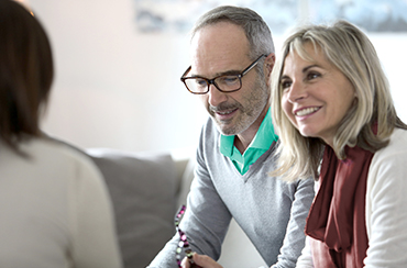 Senior couple meeting financial adviser for investment